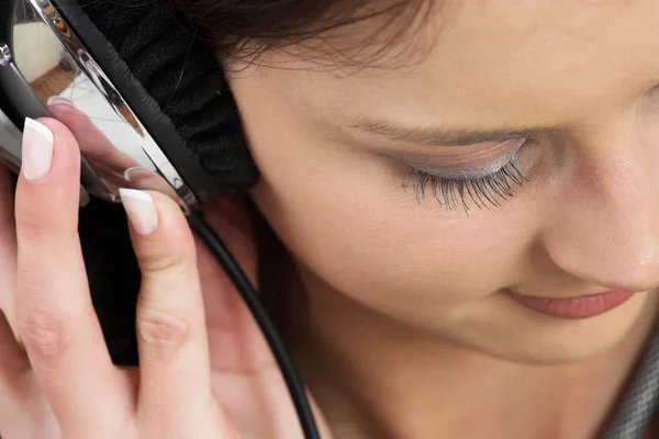 Woman in formal black suit with headset on head — Stock Photo, Image