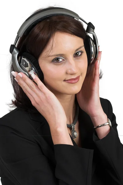 Kobieta w posiadanie czarny garnitur z słuchawki na głowę — Zdjęcie stockowe