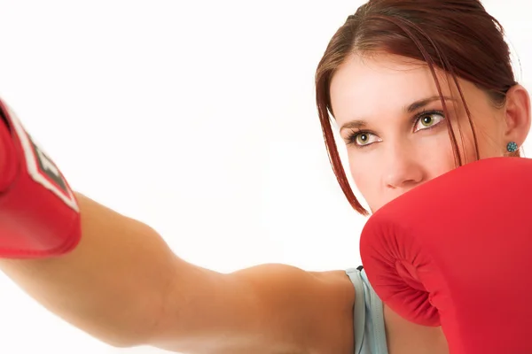 Sexy young adult Caucasian woman in a training wear with boxing gloves — Stock Photo, Image