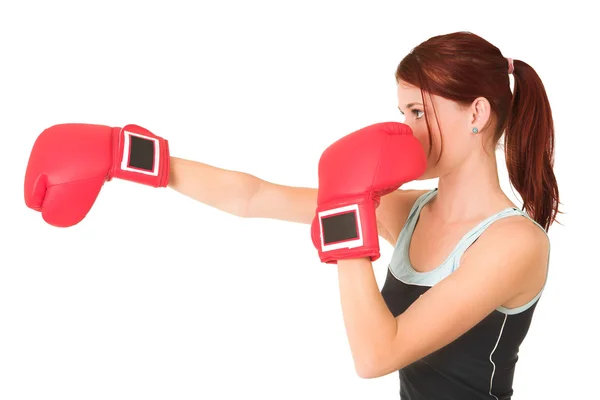 Sexy young adult Caucasian woman in a training wear with boxing gloves — Stock Photo, Image