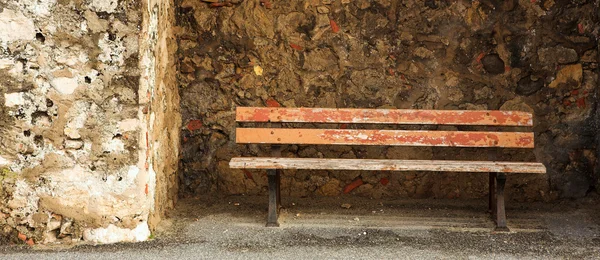 Old bench in the Original Harbour blocking wall — Stock Photo, Image