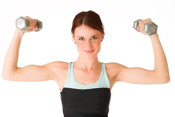 Sexy junge erwachsene kaukasische Frau in einem schwarzen Trainingsanzug mit kleinen Gewichten — Stockfoto