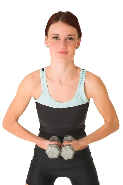 Sexy junge erwachsene kaukasische Frau in einem schwarzen Trainingsanzug mit kleinen Gewichten — Stockfoto