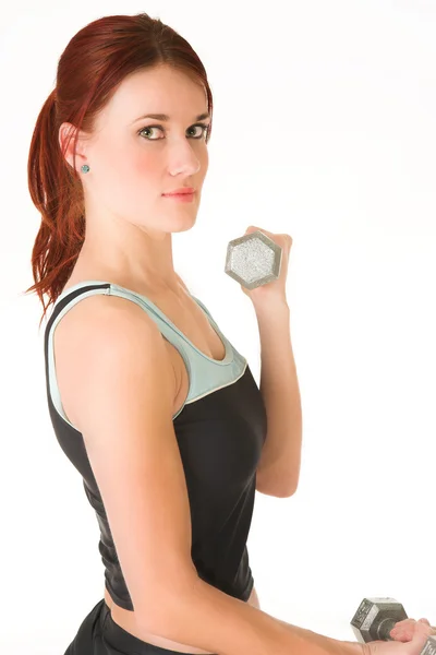 Sexy young adult Caucasian woman in a black training wear with small weights — Stock Photo, Image