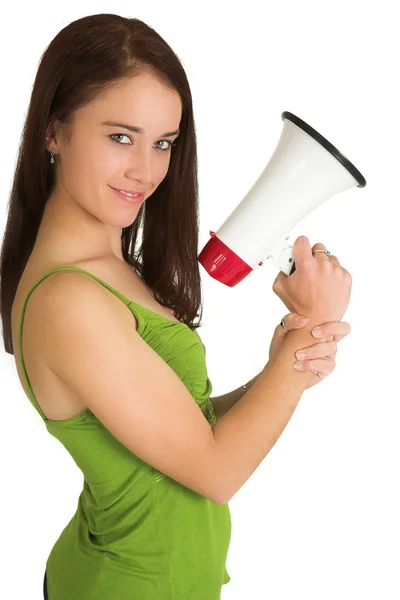 Portrait of a brunette woman,, wearing a green top, holding a megaphone — Stock Photo, Image