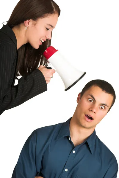 A brunette woman yelling at her male business partner over a microphone — Stock Photo, Image