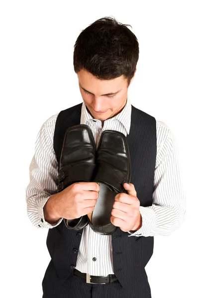 Businessman holding his shoes — Stock Photo, Image