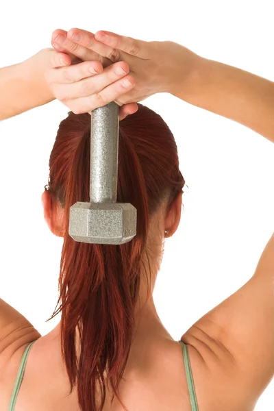 Woman standing with weight behind her back, white background. — Stock Photo, Image