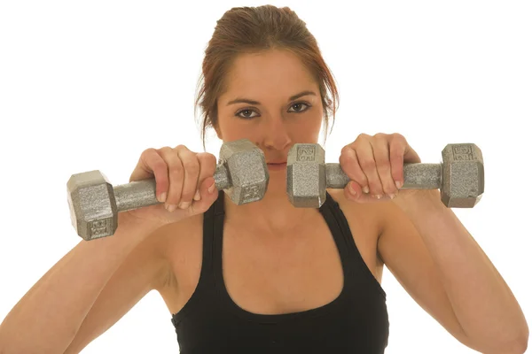 Sexy junge erwachsene kaukasische Frau in einem schwarzen Trainingsanzug mit kleinen Gewichten — Stockfoto