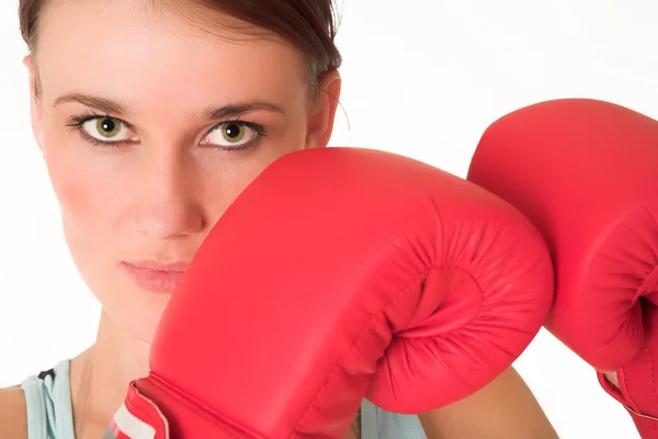 Sexy young adult Caucasian woman in a training wear with boxing gloves — Stock Photo, Image