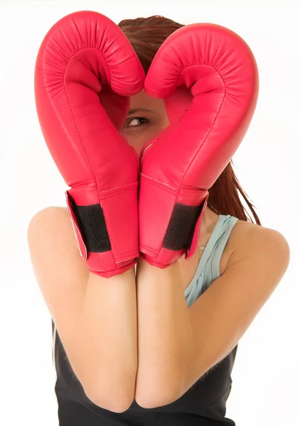 Sexy young adult Caucasian woman in a training wear with boxing gloves — Stock Photo, Image