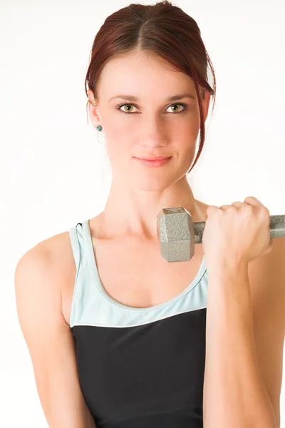 Sexy young adult Caucasian woman in a black training wear with small weights — Stock Photo, Image