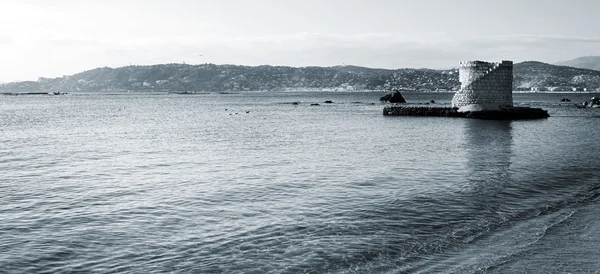 Ruins surrounded by water in Antibes, France. Copy space. — Stock Photo, Image