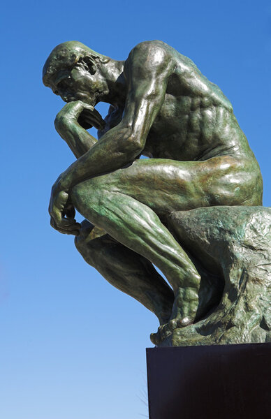 A copy of the famous bronze sculpture of Auguste Rodin The Thinker