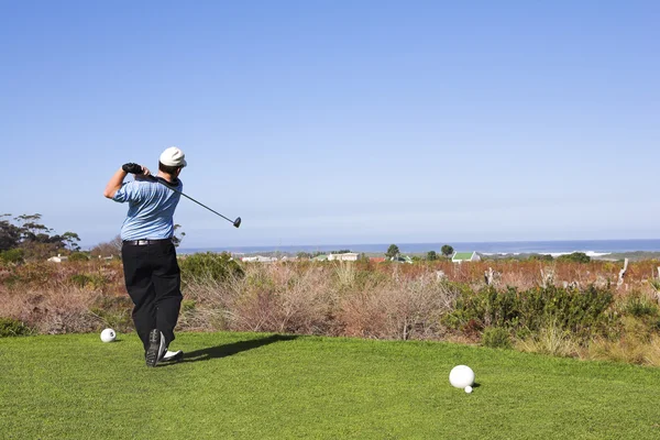 A golfer playing golf outdoors in natural landscape — Stock Photo, Image