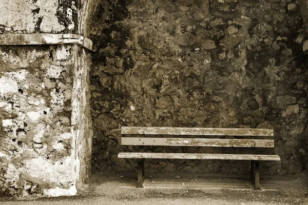 Old bench in the Original Harbour blocking wall at Baie Des Anges in Antibes, France — Stock Photo, Image