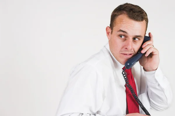 Ο άνθρωπος των επιχειρήσεων σε ένα κοστούμι με ένα τηλέφωνο — Φωτογραφία Αρχείου