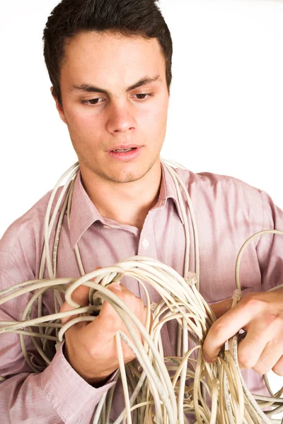 Zakenman verstrikt in een elektrische kabel — Stockfoto