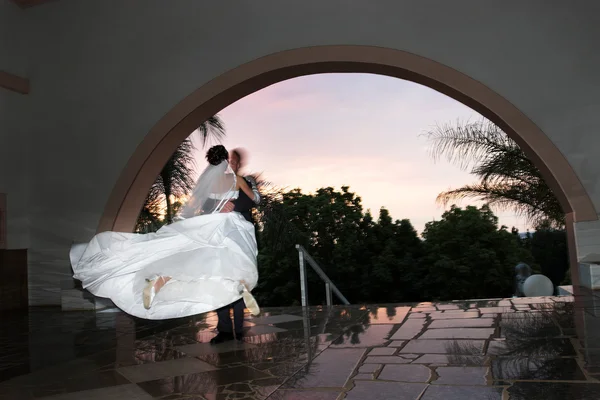 Groom swinging his bride — Stock Photo, Image