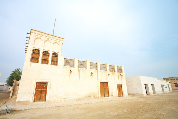 Typical old style Middle Eastern house in the desert town of Al Wakrah (Al Wakra), Qatar, in the Middle East