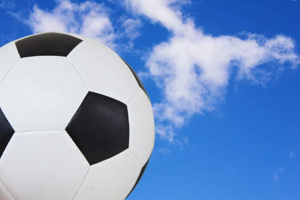 Black and White soccer ball against a summer blue sky. — Stock Photo, Image