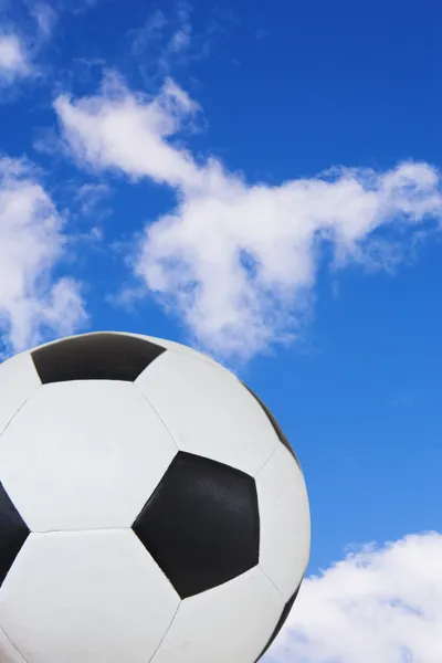 Black and White soccer ball against a summer blue sky. — Stock Photo, Image