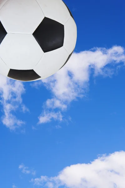 Black and White soccer ball against a summer blue sky. — Stock Photo, Image