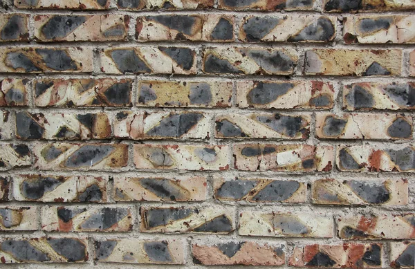 Background of wall from the old burned bricks — Stock Photo, Image