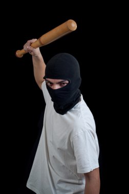 Masked man aims and attack with bat clipart