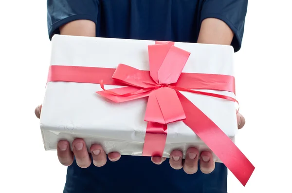 Man holding a gift box in a gesture of giving — Stock Photo, Image