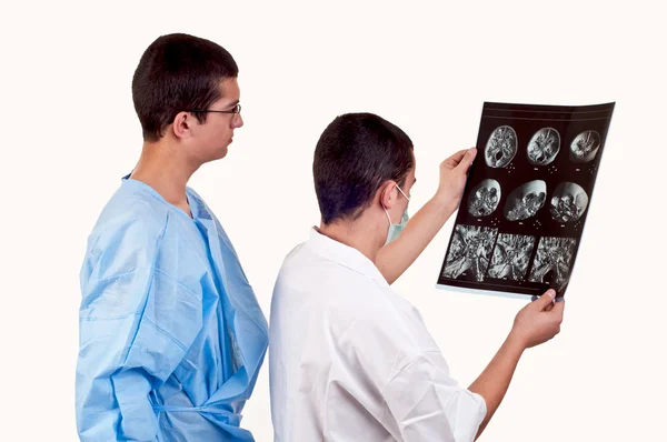 Portrait of two doctors examining a tomography — Stock Photo, Image