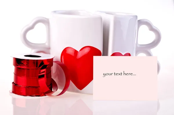 Coffee mugs in shape of hear and ribbon — Stock Photo, Image