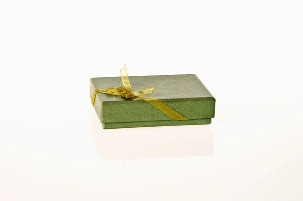 Green gift box with ribbon on white background — Stock Photo, Image