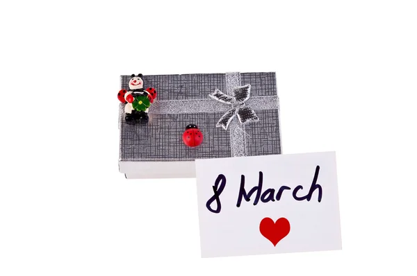 Geschenkkarton mit Marienkäfern und Postkarte mit Herz — Stockfoto