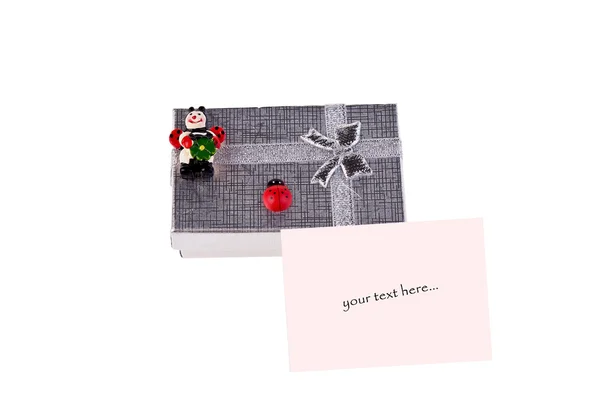 Gift box with ladybugs and pink postcard — Stock Photo, Image