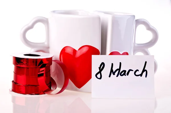 March 8. Coffee mugs in shape of hear whit hearts — Stock Photo, Image