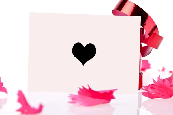Red ribbon and pink card whit heart — Stock Photo, Image