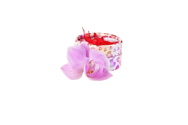 Pink orchid and white gift box whit red hearts — Stock Photo, Image