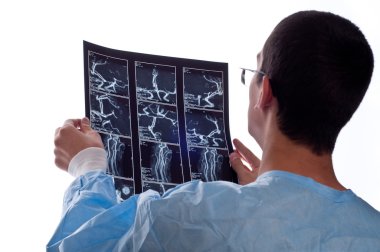 surgeon looking at CT computer tomography scan image clipart
