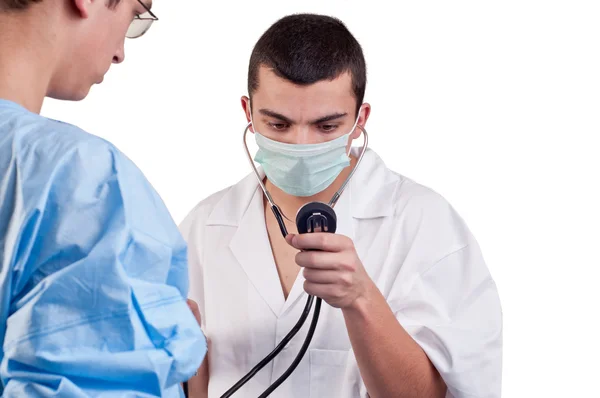 Doctor measuring the patient's blood pressure before surgery — Stock Photo, Image