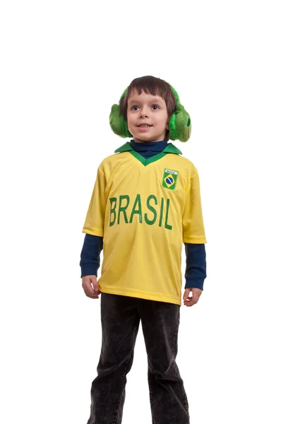 Liten pojke bär ett par fluffiga hörselkåpor i form av groda — Stockfoto