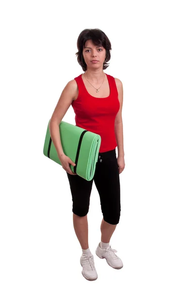 Beautiful young woman holding exercise mat - getting ready for exercise — Stock Photo, Image