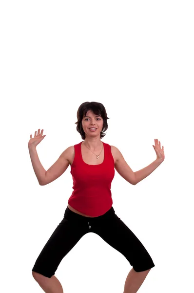 Beautiful brunette young woman doing a funny yoga pose — Stock Photo, Image