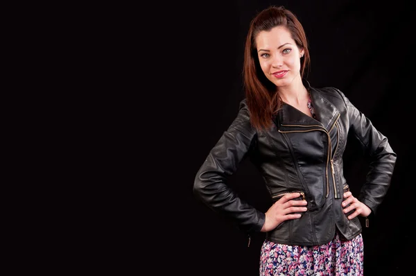 Glamorous young woman in black leather jacket on black backgroun — Stock Photo, Image