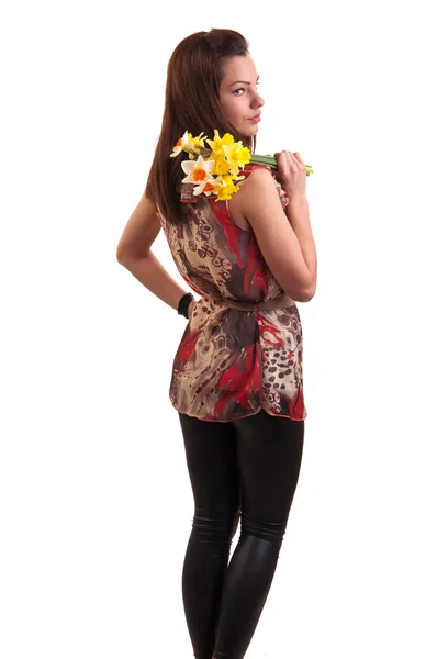 Young sensual woman yellow with bouquet of daffodils on her shou — Stock Photo, Image