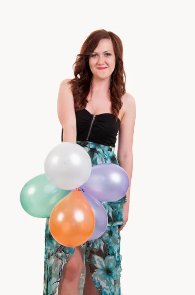 Young happy girl with a bunch of colored balloons — Stock Photo, Image