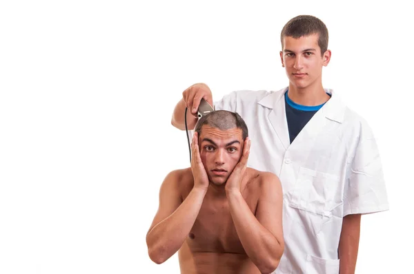 Young man is surprised that the barber by mistake wrong cut hair — Stock Photo, Image
