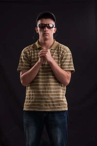 Serious and thoughtful teenage boy with sunglasses and baseball — Stock Photo, Image