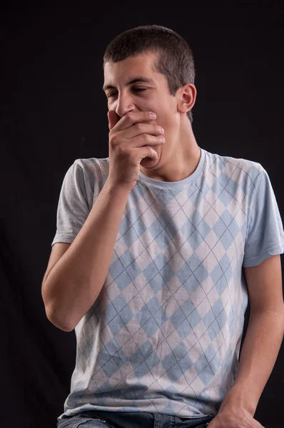 Tired teenager yawning and stretching, is moody — Stock Photo, Image