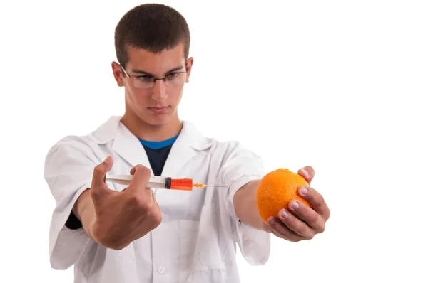 Toxin injection in orange with syringe. Genetically modified foo — Stock Photo, Image